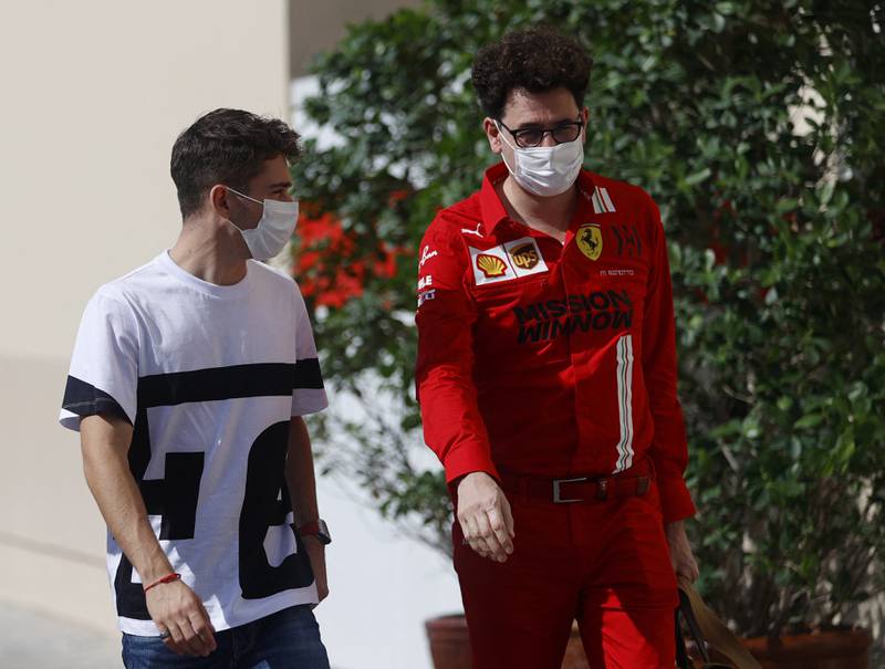 Ferrari team principal Mattia Binotto and driver Charles Leclerc arrive ahead of practice. Reuters