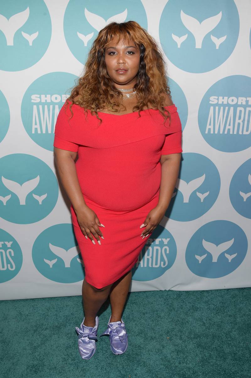 Lizzo with highlighted hair and a bright, mid-length dress and lilac shoes at the Annual Shorty Awards at PlayStation Theatre on April 23, 2017, in New York City. Getty Images