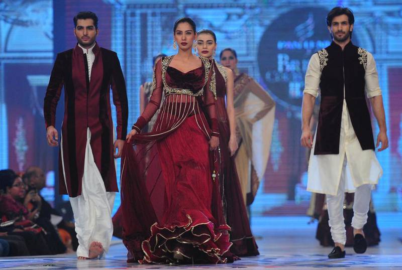 Models present creations by Pakistani designer Mansoor Akram during the first day of the Bridal Couture Week in Karachi on May 9, 2014. AFP