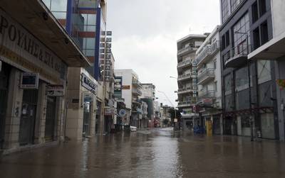 Water covers a main street after a rainstorm in Volos, central Greece.  AP
