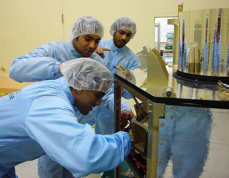Three of the 16 Emirati engineers assigned to the DubaiSat-1 project work on the satellite in Daejeon, South Korea.