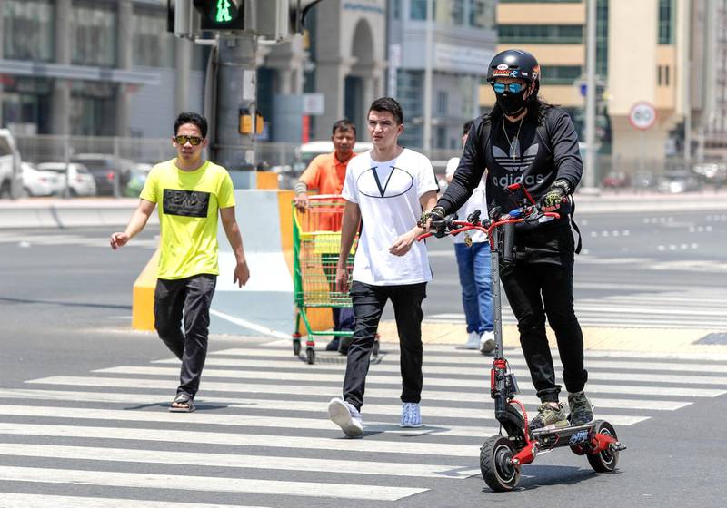 Abu Dhabi, United Arab Emirates, August 13, 2019.  People using E-scooters at the Al Wahda mall area, downtown Abu Dhabi. --  Sam Soliguen, takes an E-scooter everyday to work at downtown Abu Dhabi.Victor Besa/The NationalSection:  NAFOR:  Standalone