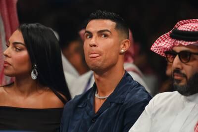 Cristiano Ronaldo watches the fight from ringside. Getty
