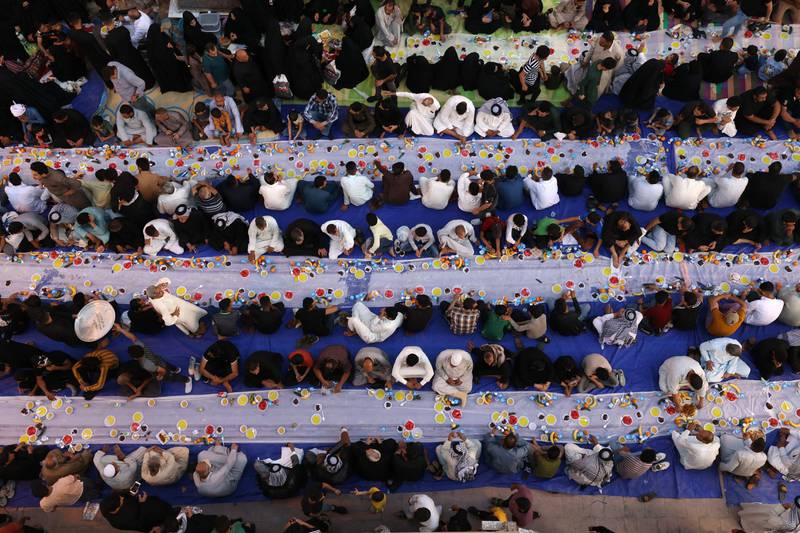 Muslims gather for iftar along a street in the Iraqi shrine city of Najaf, 160 kilometres south of Baghdad. AFP