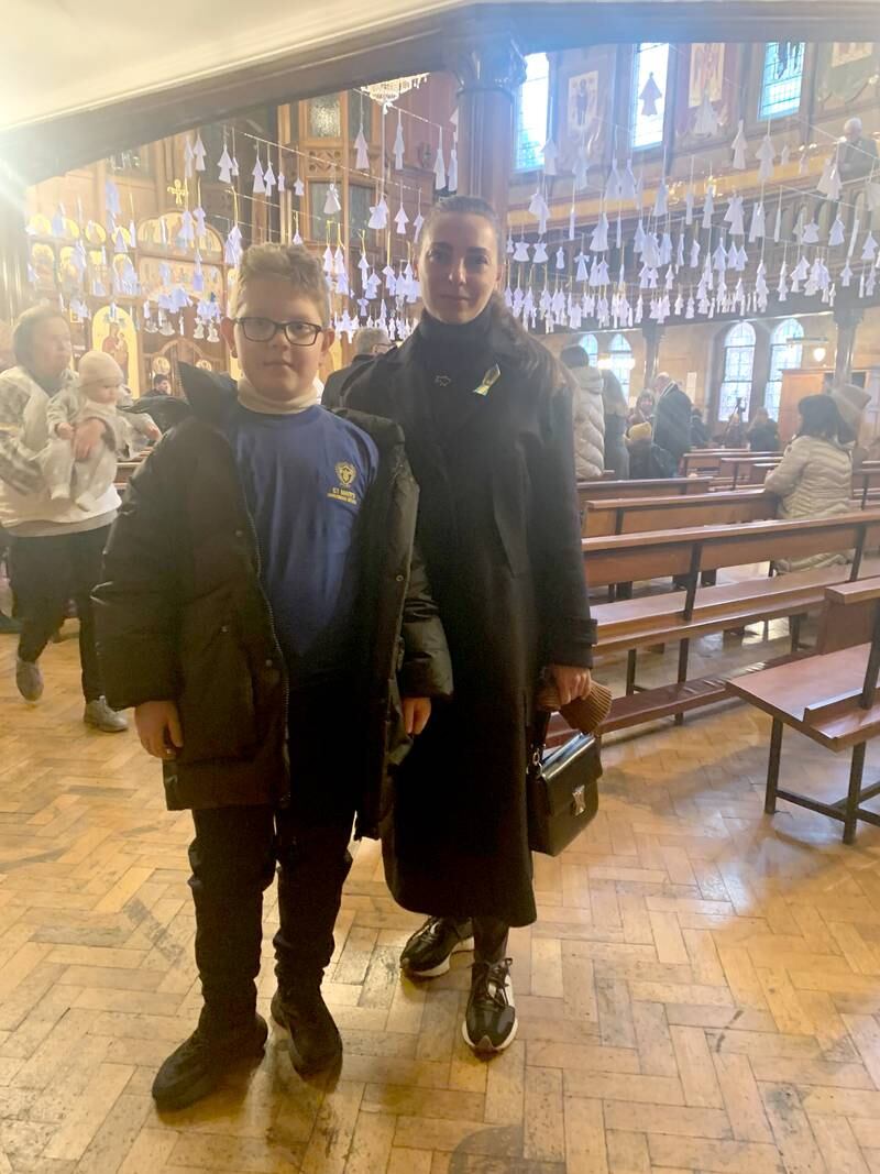 Natalie Parasiuc and her son Alexander at the Ukrainian Catholic Cathedral in London. The National 