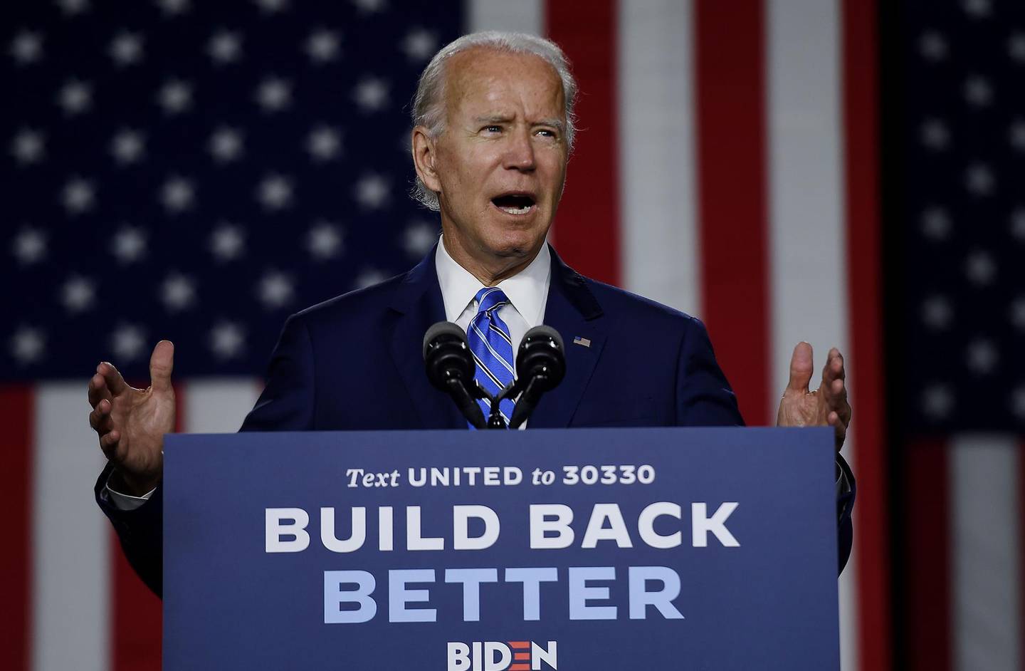 (FILES) In this file photo taken on July 13, 2020 Democratic presidential candidate and former Vice President Joe Biden speaks at a  "Build Back Better" Clean Energy event at the Chase Center in Wilmington, Delaware.  Donald Trump has 100 days from Sunday to save his presidency as America tries to avoid a collective nervous breakdown ahead of one of the most divisive, tension-filled elections in US history. / AFP / Olivier DOULIERY

