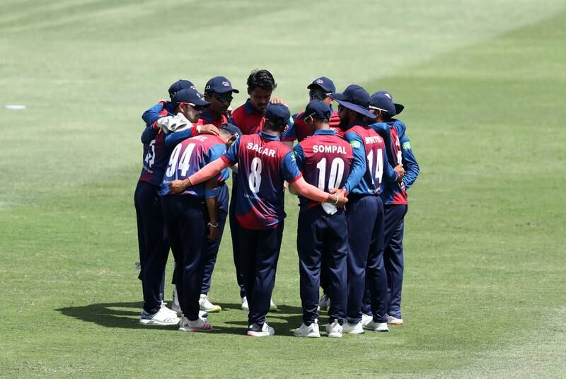 The Nepal team huddle after bowling out the UAE for 168. 