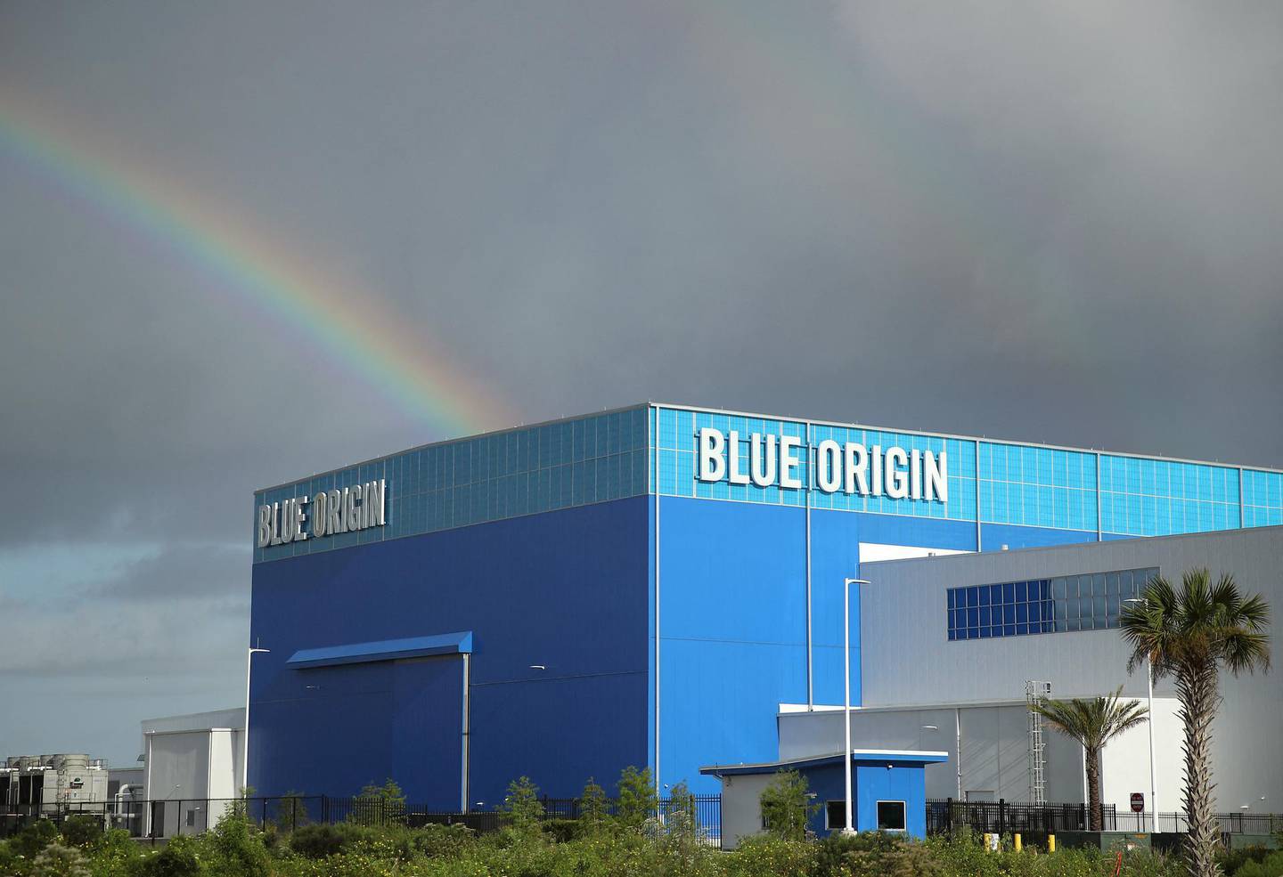 CAPE CANAVERAL, FLORIDA - AUGUST 31: Storm clouds and a rainbow appear over Jeff Bezos Blue Origin Aerospace Manufacturer building as Hurricane Dorian approaches Florida, on August 31, 2019 in Cape Canaveral, Florida. Dorian could be a Category 4 storm as it approaches the state and possibly making landfall as early as Monday somewhere along the east coast.   Mark Wilson/Getty Images/AFP (Photo by MARK WILSON / GETTY IMAGES NORTH AMERICA / Getty Images via AFP)