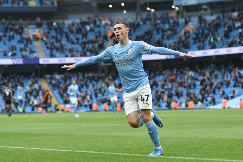 Manchester City's midfielder Phil Foden celebrates scoring their third goal. AFP