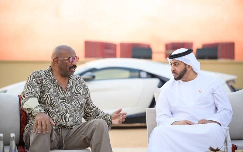 Sheikh Hamdan bin Zayed and Harvey chat during the sheikh's visit at Liwa International Festival