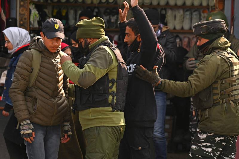 Indian paramilitary forces search pedestrians in Srinagar in January 2023. AFP