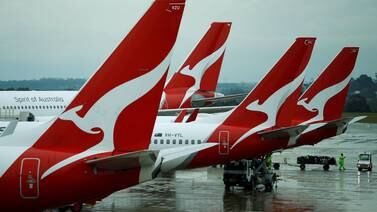 An image that illustrates this article Qantas executives asked to help with baggage handling for three months