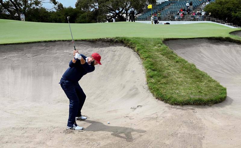 US player Dustin Johnson hits out of a bunker. AFP