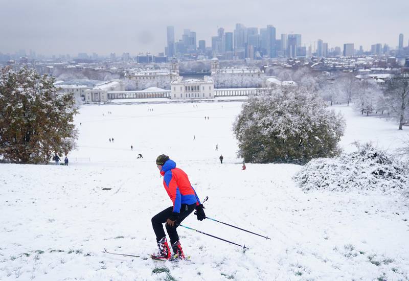 Heavy snowfall swept across the UK on Monday, with one keen skier taking to the slopes of Greenwich Park, south-east London. PA