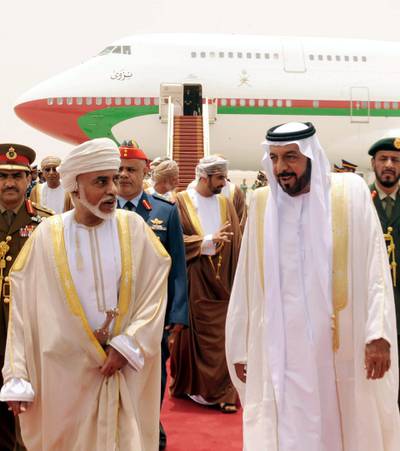 epa02819883 A handout picture released by Emirates News Agency (WAM) shows United Arab Emirates's President and Ruler of Abu Dhabi Sheikh Khalifa bin Zayed al-Nahayan(R) walking with His Majesty Oman's leader Sultan Qaboos bin Said (L) upon his arrival to al-Ain Airport , United Arab Emirates on 11 July 2011. Reports state that Sulatn Qaboos is visiting the state on the invitation of President Khalifa for talks on bilateral relations between UAE and Oman.  EPA/EMIRATES NEWS AGENCY / HANDOUT  HANDOUT EDITORIAL USE ONLY/NO SALES *** Local Caption ***  02819883.jpg