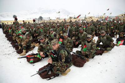 Afghan Army commandos attend their graduation ceremony in thick snow in Kabul. AP Photo
