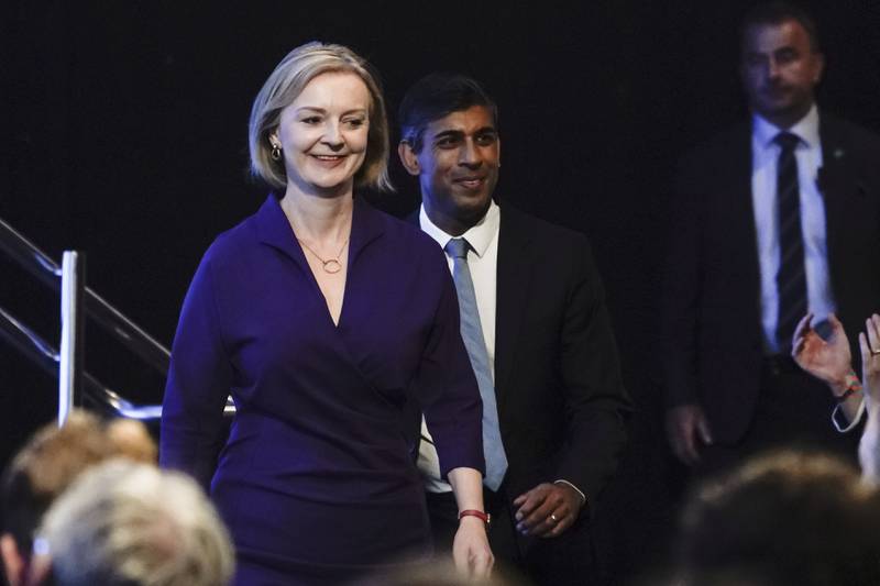 Liz Truss arriving at the Queen Elizabeth II Centre in London on Monday, where she was declared the winner of the Conservative Party leadership race with Rishi Sunak (centre). AP