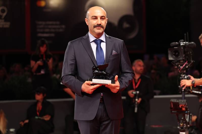 Houman Seyyedi with the Orizzonti Award for Best Film for 'World War III'. Getty Images