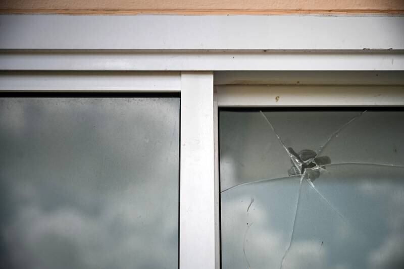 A bullet holes is seen on a window at the child care center. Getty Images