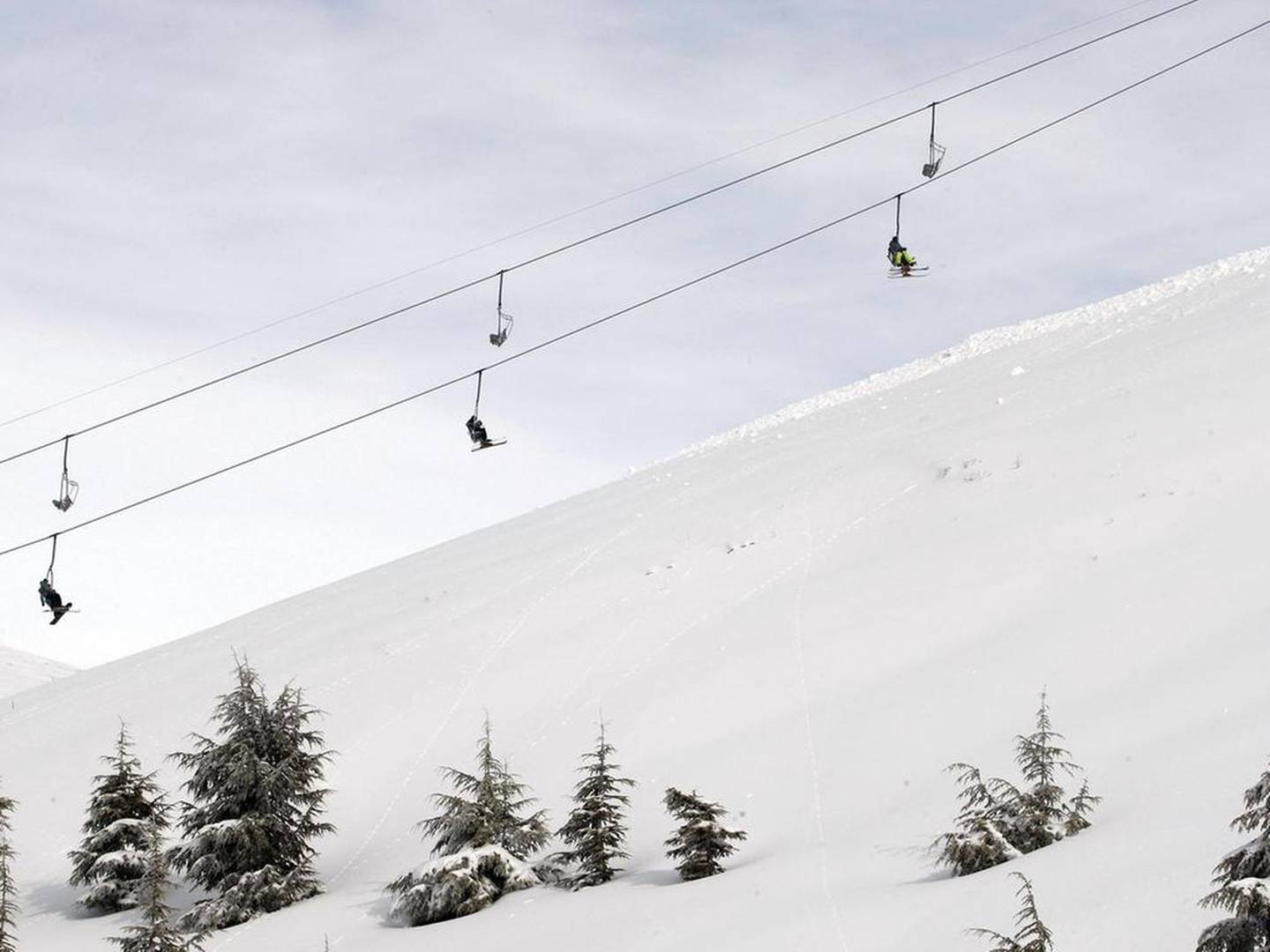 Skiers ride a lift at the Mzaar Ski Resort, one hour from Beirut, Lebanon. Getty Images