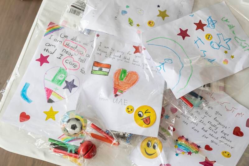 Drawings made by children in Dubai to be sent with special packages for flood victims in Pakistan. Antonie Robertson / The National 


