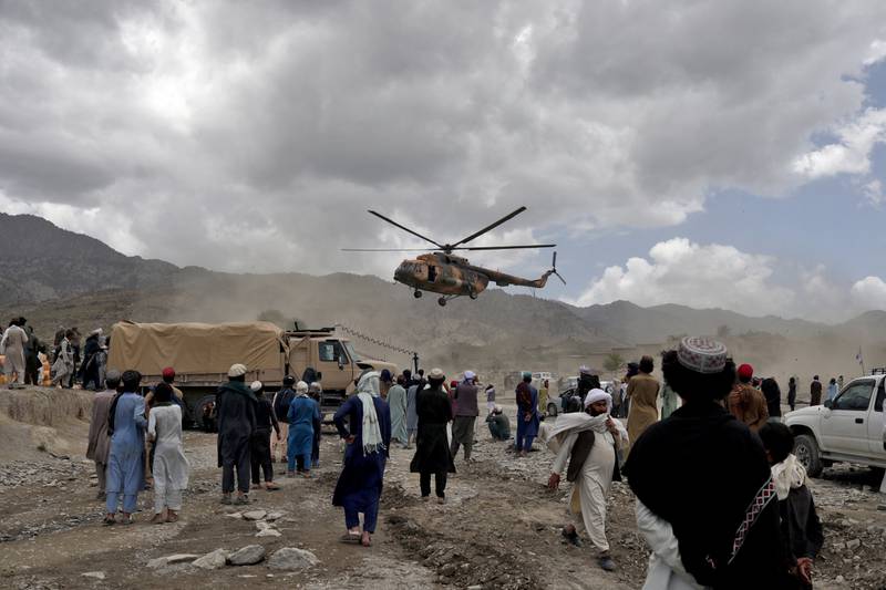 A Taliban helicopter carrying aid lands in Gayan. Reuters