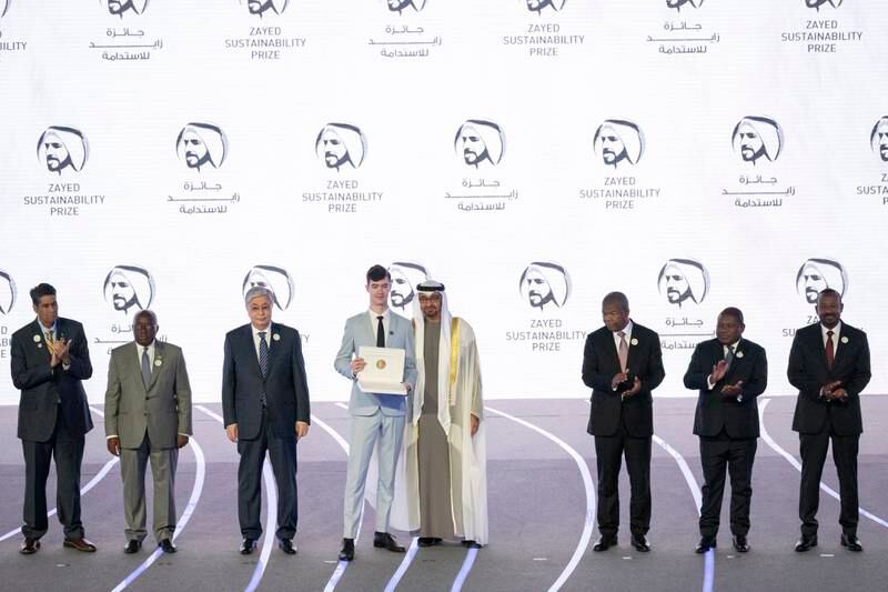 Sheikh Mohamed presents the 2023 Zayed Sustainability Prize for Europe & Central Asia Global High Schools to a representative from Germany's Romain-Rolland Gymnasium. Photo: UAE Presidential Court