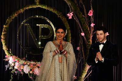 Newlyweds Priyanka Chopra, 36, and Nick Jonas, 26, pose for a photograph during a reception at a hotel in New Delhi on December 4, 2018. Photo: AFP
