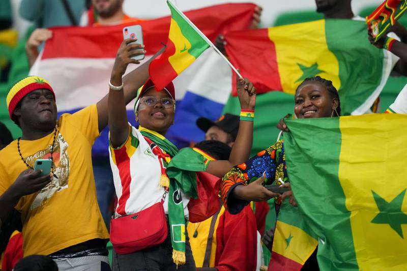 Others settled for flags, hats and selfies. AP Photo