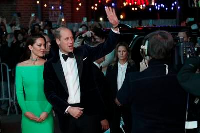 Prince William waves to the throngs of American fans in Boston. AP
