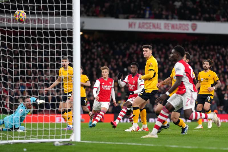 Wolves goalkeeper Jose Sa, left, concedes his side's second goal from Arsenal's Alexandre Lacazette at the Emirates Stadium. PA