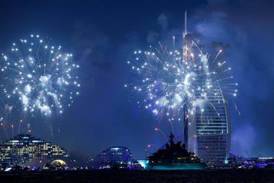 Fireworks light up the sky by the Burj Al Arab hotel. Giuseppe Cacace / AFP