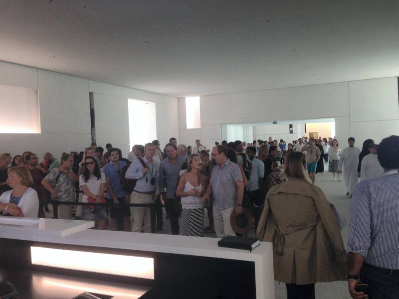 Visitors enter Louvre Abu Dhabi on its opening day. John Dennehy / The National