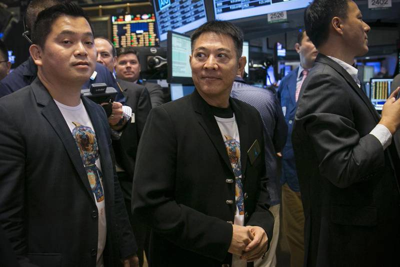 Chinese actor Jet Li, centre, attends the Alibaba initial public offering at the New York Stock Exchange. Brendan McDermid / Reuters