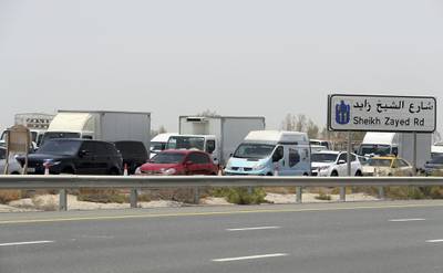 DUBAI, UNITED ARAB EMIRATES , July 15 – 2020 :- Traffic jam at the Dubai border going towards Abu Dhabi on Sheikh Zayed road in Dubai. (Pawan Singh / The National) For News/Online