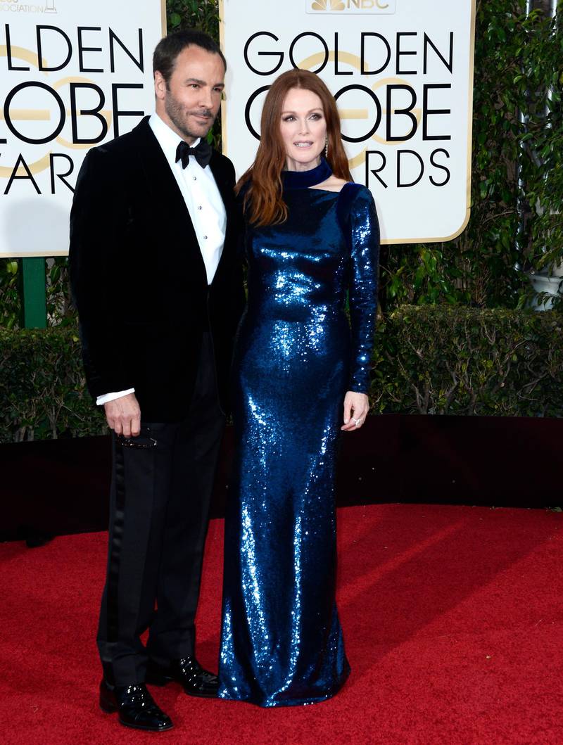 epa05096477 Tom Ford (L) and Julianne Moore arrive for the 73rd Annual Golden Globe Awards at the Beverly Hilton Hotel in Beverly Hills, California, USA, 10 January 2016.  EPA/PAUL BUCK