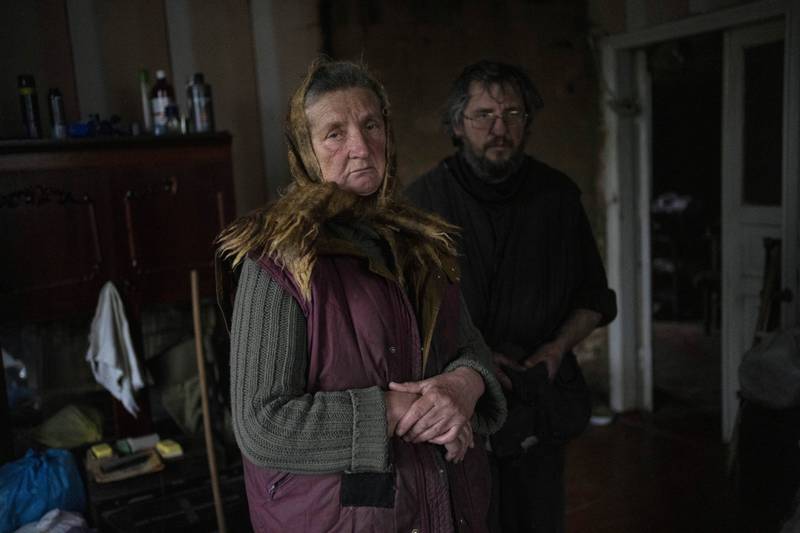 Nadiya Trubchaninova, 70, with her son Oleg Trubchaninov, 46, inside the room of her son Vadym, 48, who was killed by Russian soldiers on March 30 in Bucha. AP