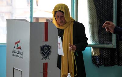 A woman prepares her ballot at a polling station in a southern suburb of Beirut. AFP
