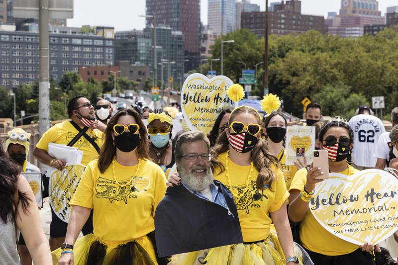 Hundreds of Covid survivors march across the Brooklyn Bridge on Saturday, August 7, 2021, in New York. AP