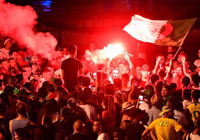 Algeria supporters celebrate at the old harbour in Marseille, southern France. AFP