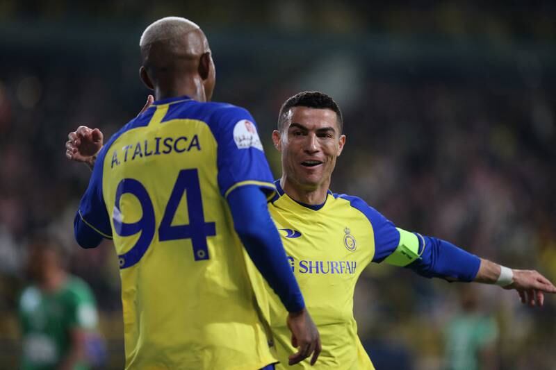 Cristiano Ronaldo celebrates with Anderson Talisca. Reuters