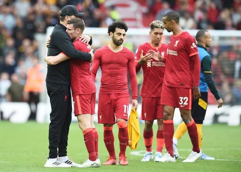 Liverpool manager Jurgen Klopp hugs James Milner after the Premier League game against Wolverhampton Wanderers at Anfield. Liverpool won the game 3-1 but missed out on winning the Premier League title to Manchester City by one point. EPA