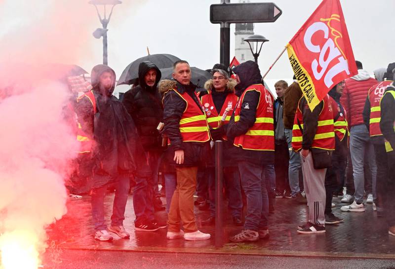 Union members of the Confederation Generale du Travail protest at the Place d'Armes in Calais. AFP