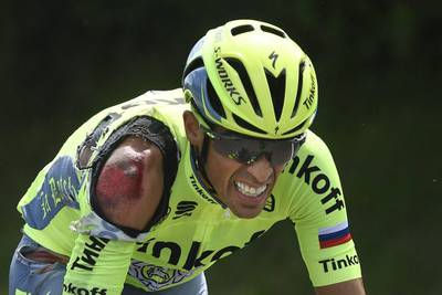 Spain’s Alberto Contador grimaces as he rides to catch up with the pack after crashing during the first stage of the Tour de France first stage of the Tour de France cycling race from Mont Saint-Michel to Utah Beach, France, Saturday, July 2, 2016. Jerome Prevost / Pool via AP