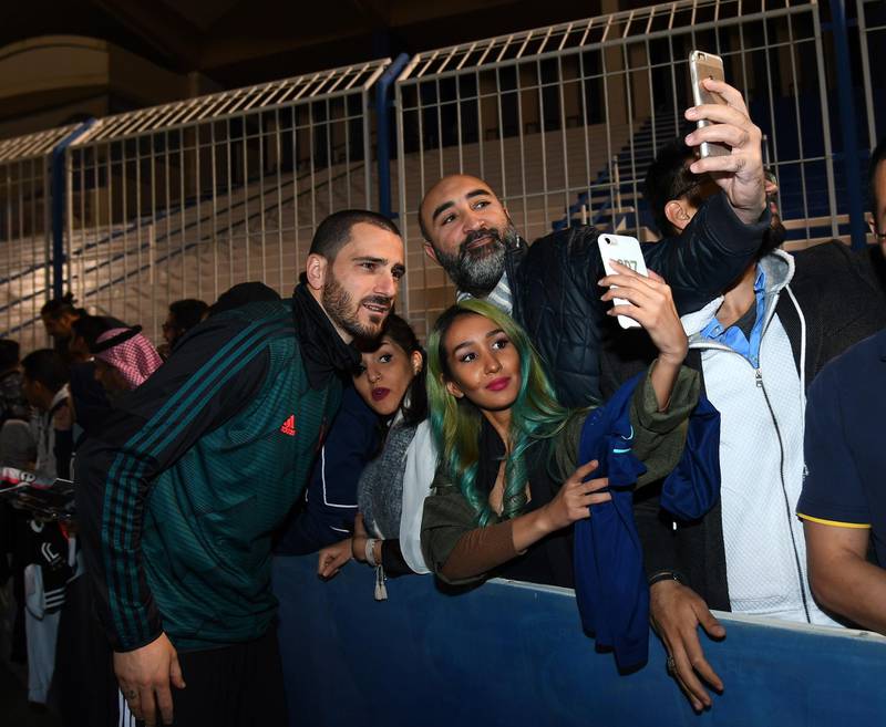 Leonardo Bonucci of Juventus signing autographs and taking selfies. Getty