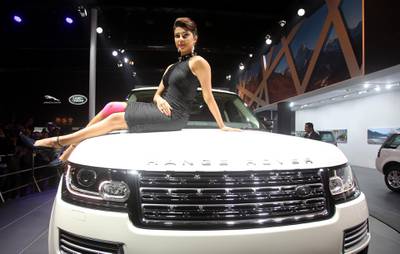 epa04055578 Bollywood actor Priyanka Chopra poses durring the launch of the Jaguar Range Rover LWD Autobiography Black at the 12th Auto Expo in Greater Noida, India, 05 February 2014. India's flagship automobile show Auto Expo starts 05 February 2014 with auto mobile companies launching new models and ends at 11 February 2014.  EPA/MONEY SHARMA