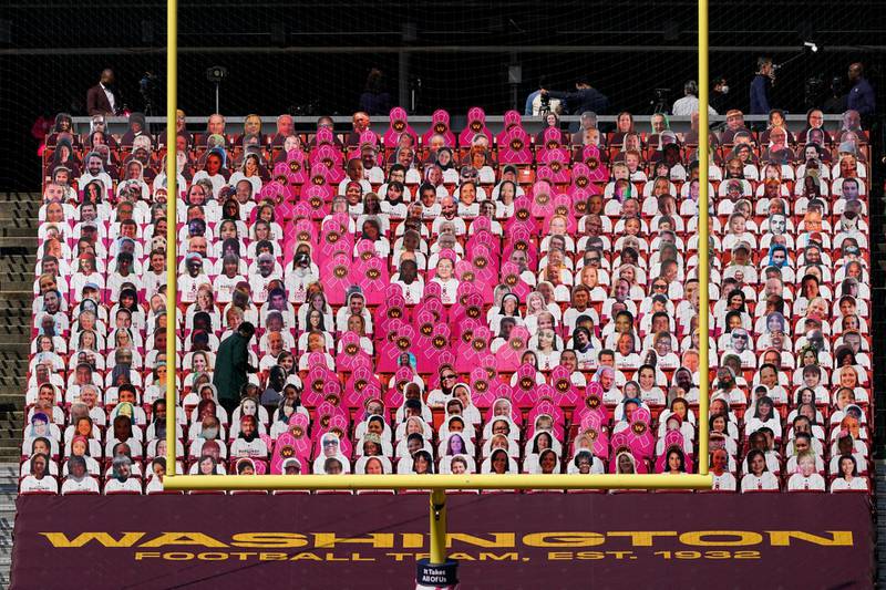 A Breast Cancer Awareness sign is seen before the first half of an NFL football game between the Washington Football Team and the Baltimore Ravens, Sunday, Oct. 4, 2020, in Landover, Md. (AP Photo/Susan Walsh)