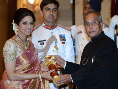 This photo taken on April 5, 2013 shows then-Indian President Pranab Mukherjee (R) presenting the Padma Shree award to Indian film actress Sridevi (L) during the presentation of the "Padma Awards 2013" at the Presidential Palace in New Delhi. AFP