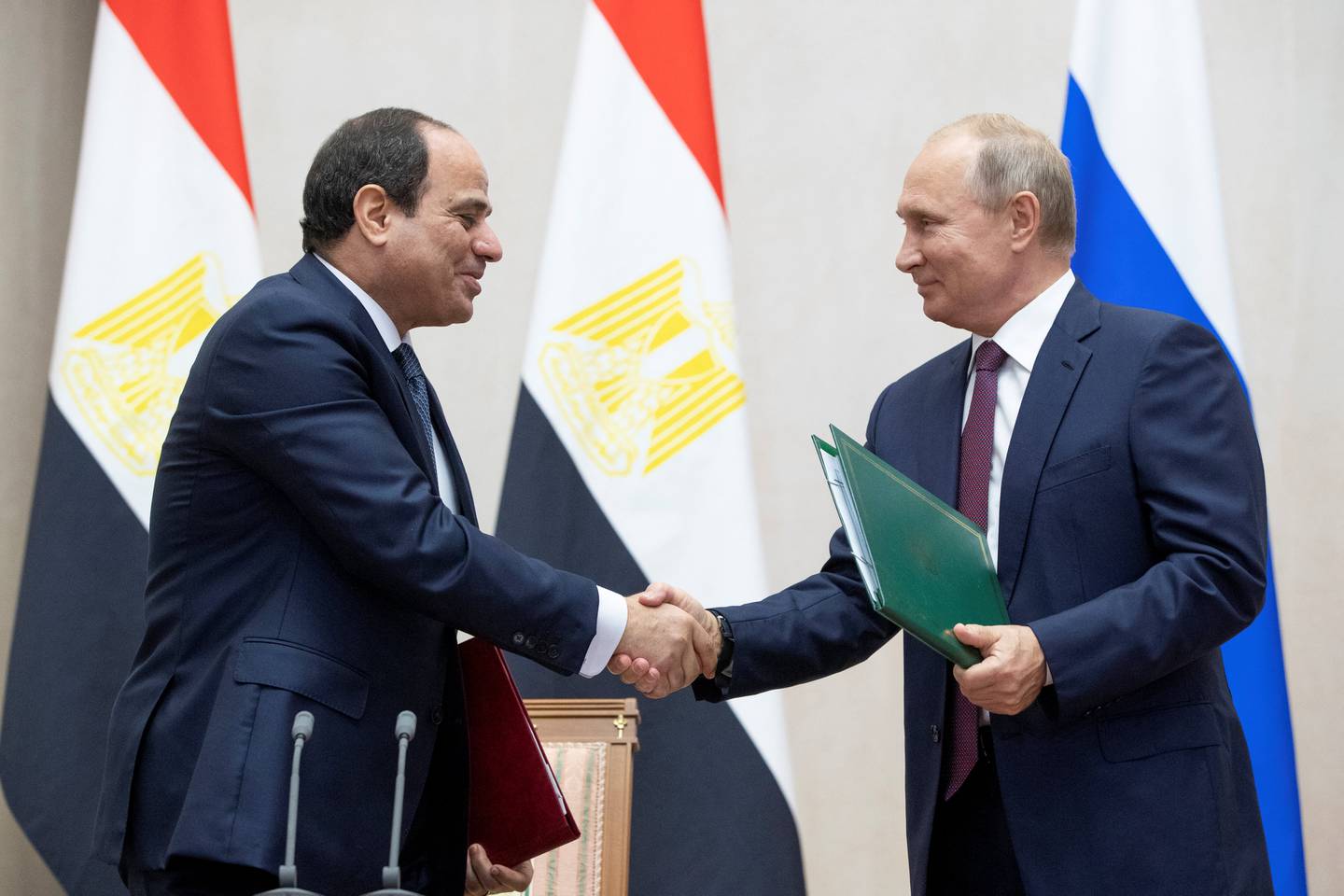 Russian President Vladimir Putin and Egyptian President Abdel Fattah al-Sisi shake hands during a signing ceremony following their meeting in the Black Sea resort of Sochi, Russia October 17, 2018. Pavel Golovkin/Pool via REUTERS