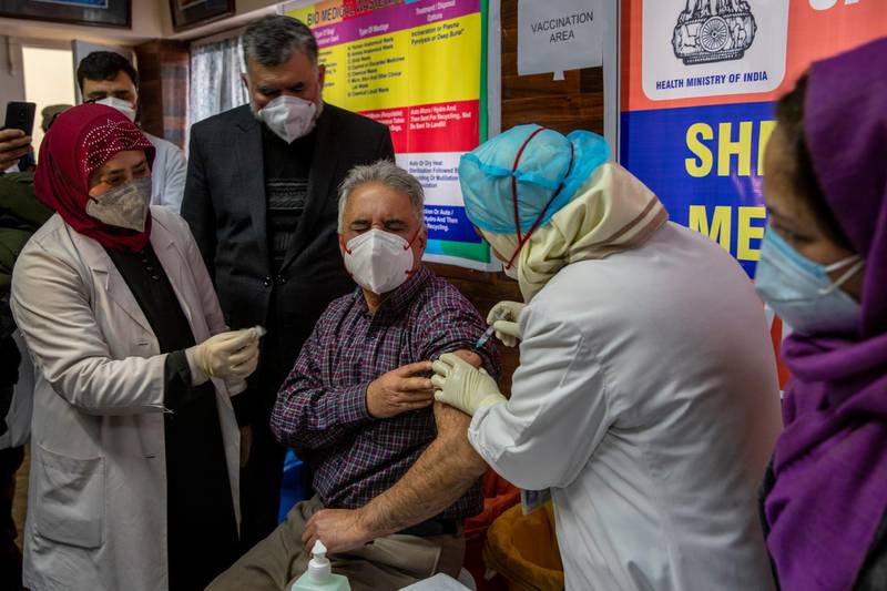 A Kashmiri doctor receives a Covid-19 vaccine at a government hospital in Srinagar, Kashmir. AP Photo